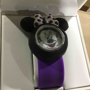 Two pink and one purple Mikey mouse watches.